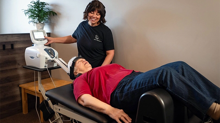 Chiropractic Assistant Pam With Decompression Patient